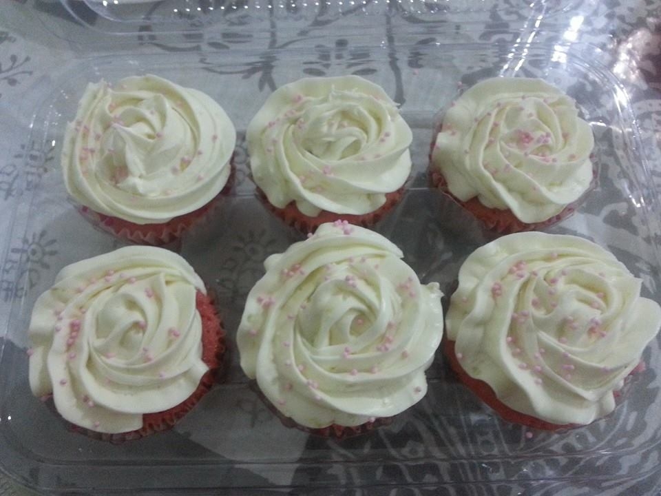Marbled pink and white Vanilla Cupcakes soaked in strawberry syrup-citrus cream cheese frosting
