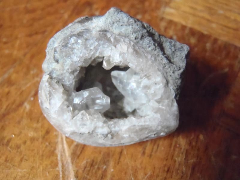 A brachiopod geode with calcite crystals inside.