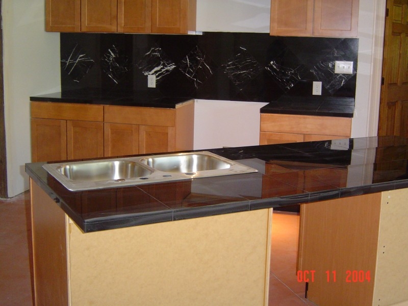 Black Granite Tile With Marble Accents