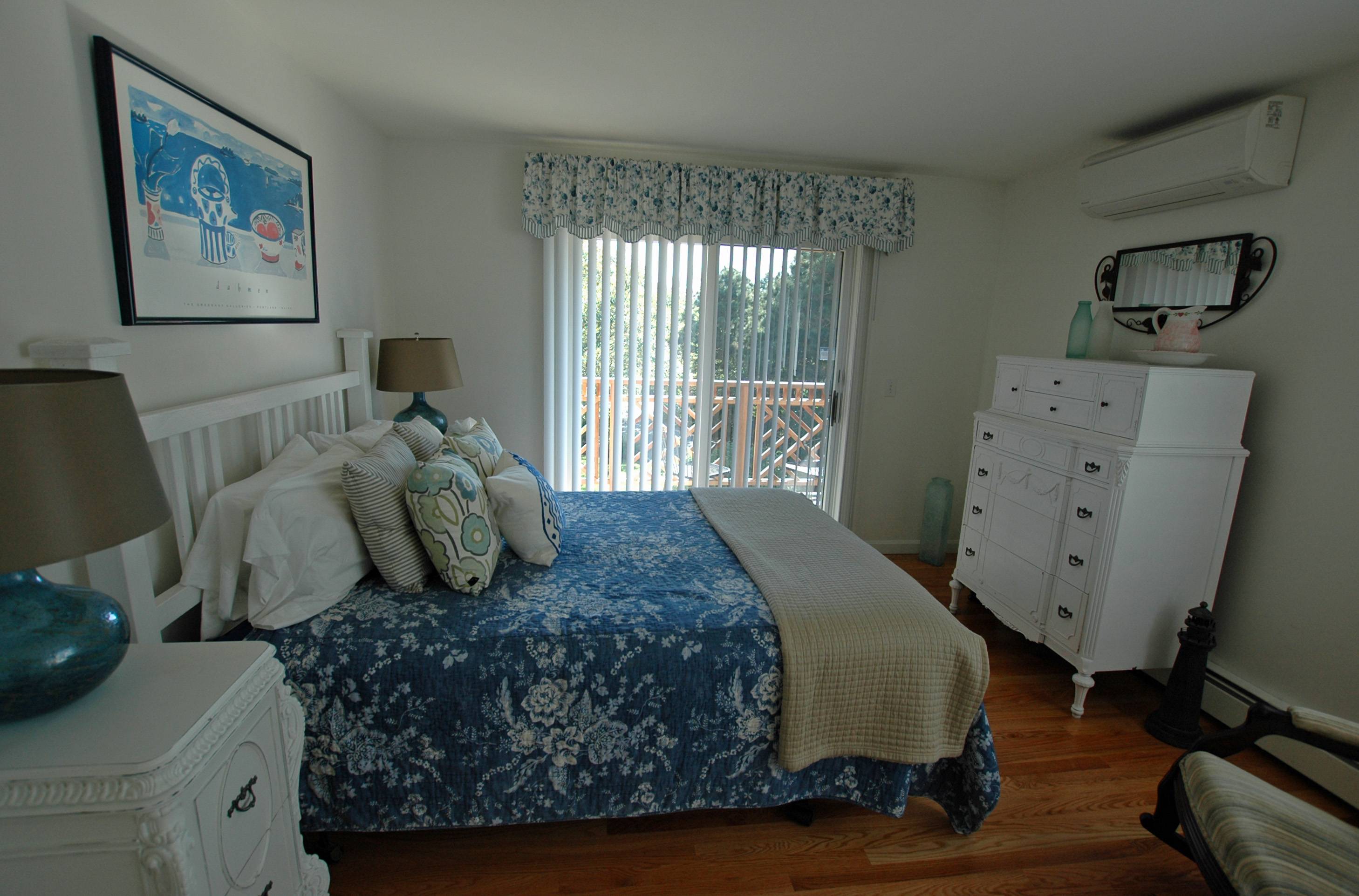 Blue queen-sized bedroom.