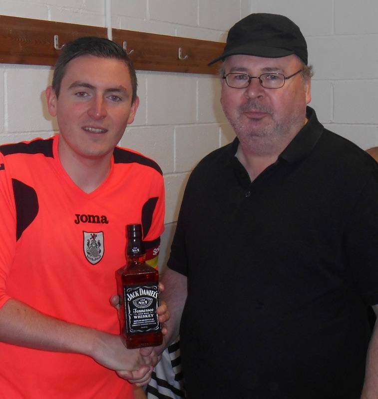 ALAN GALINDO RECEIVES A BOTTLE AFTER MAKING HIS 100TH APPEARANCE