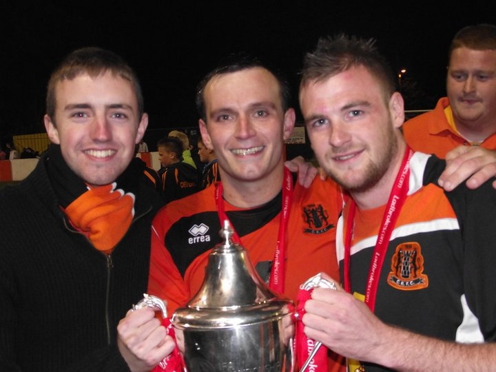 Holding the Championship Trophy with Carrick captain Glenn Taggart