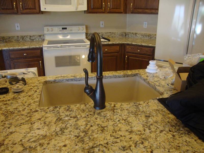 New granite in kitchen and plumbing fixtures